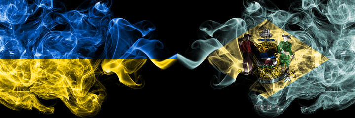 Ukraine, Ukrainian vs United States of America, America, US, USA, American, Delaware smoky mystic flags placed side by side. Thick colored silky abstract smokes flags.
