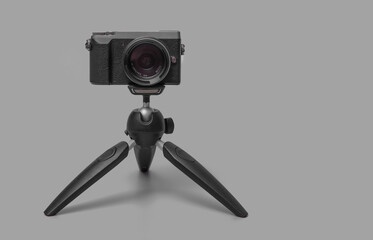 digital photo camera on small tripod