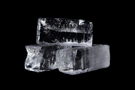 Large Melting Cube Of Clear Ice On Black Background,Translucent Ice Block