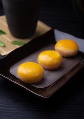 Chinese pastry puff, Beans cake with salted egg yolk lay on table wood,Homemade bakery concept.