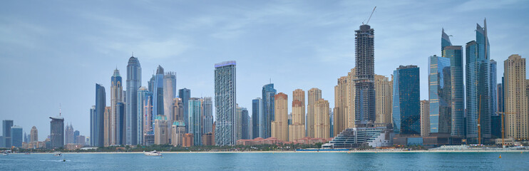 high-rise buildings stand on the horizon, modern Dubai
