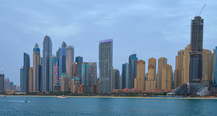 high-rise buildings stand on the horizon, modern Dubai
