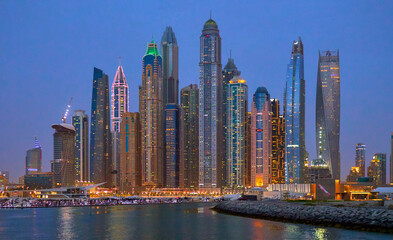 Plakat high-rise buildings stand on the horizon, modern Dubai