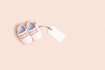 Gender neutral baby shoes with mockup tag