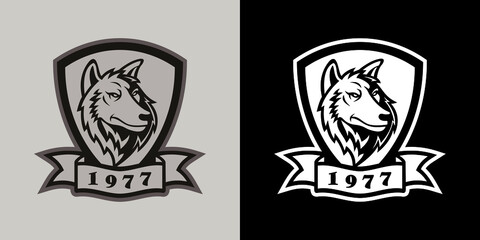 Wolf head mascot logo in shield with flag