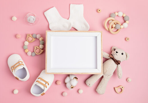 Mockup of empty frame with eco friendly baby accessories
