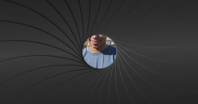 Camera shutter clicking effect against against portrait of male soccer player holding a soccer ball