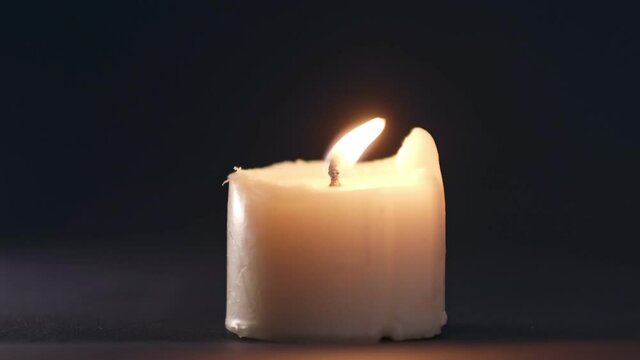 single white candle burning funeral death obituary peace background light candle light white