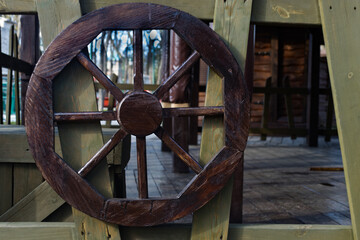 Old wooden wheel,cart wheel,entrance interior