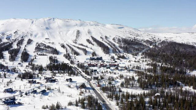 Trillevallen ski slopes. Swedish ski resort mountain aerial drone view on sunny day in winter. Åre Sweden