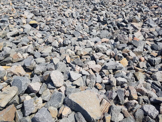 Background of broken stones close-up. Broken gravel texture