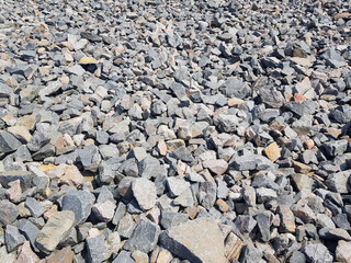 Background of broken stones close-up. Broken gravel texture