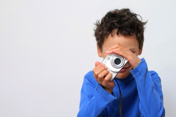 boy holding camera with white background stock photo