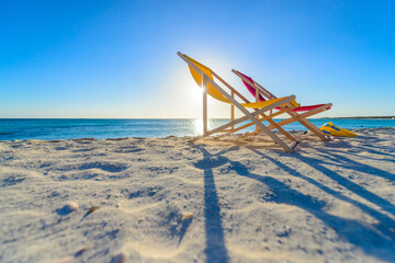 Colorful beach lounge chairs at the beach