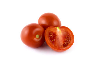 two juicy red tomatoes and one cut up