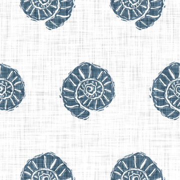 Blue scallop shell block print on a soft white linen texture background. Seamless bright summer cloth fabric for fresh coastal cottage beach decor. Modern stylised marine sea life hand drawn linocut
