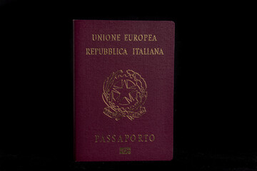 Italian passport in background black