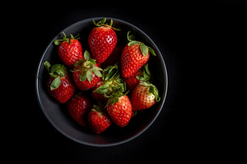 Strawberries in background black