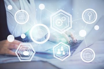 Double exposure of woman hands typing on computer and social network theme hologram drawing. People media concept.