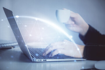 Double exposure of woman hands typing on computer and social network theme hologram drawing. People media concept.