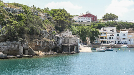 Old ruins by the sea at harbour of Mahon, Spain