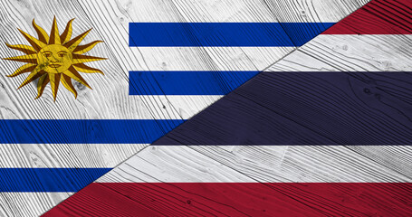 Fototapeta premium Flag of Uruguay and Thailand on wooden planks