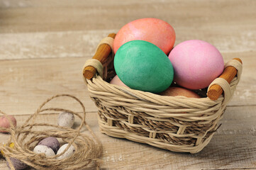 painted easter eggs in a wicker basket