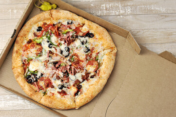 pizza with meat and tomatoes