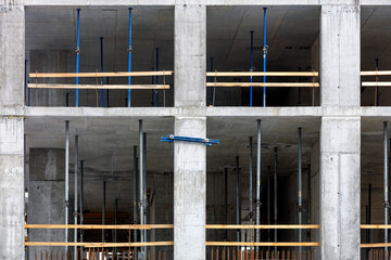 Fragment of the construction phase of the building using the monolithic-frame method with metal...