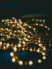 gold silver pearl beads on a dark background, on a dark table