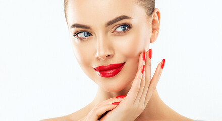Beautiful woman showing red  manicure nails . Makeup, beauty and cosmetics. Famele beauty face care...