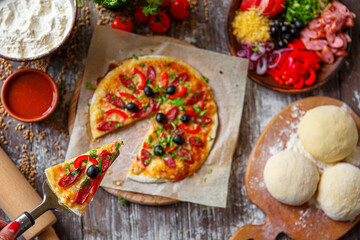 Woman holding piece of pizza