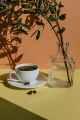 breakfast with a cup of black coffee on a colored background 