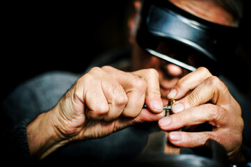 Obraz na płótnie Canvas Man work - handcrafting jewellery.