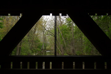 Covered bridge looking out over a river