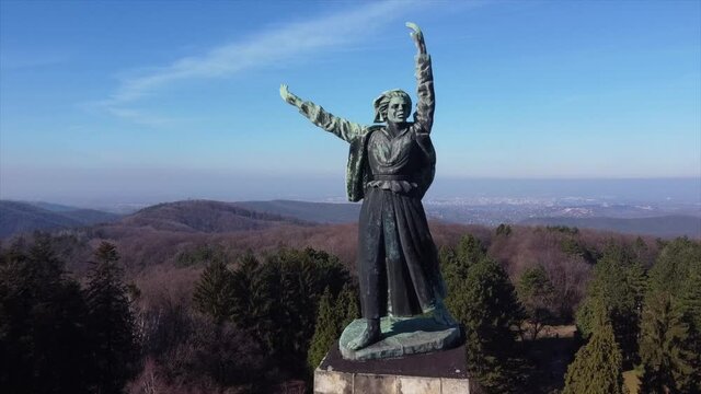 Aerial drone view of NOVI SAD, The Freedom Monument, dedicated to the anti-fascist resistance in occupied Vojvodina, SERBIA. Fru&scaron;ka gora mountain. Close footage. Happy liberty. 4K