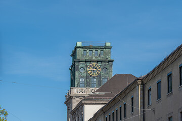 Fototapeta na wymiar The clock tower of the technical university in Munich, Bavaria, Germany