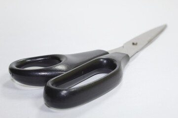 Scissors for cutting paper with white background