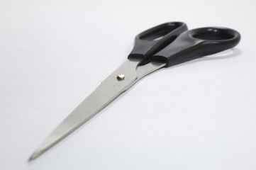 Scissors for cutting paper with white background