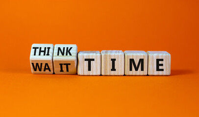 Think or wait time symbol. Turned wooden cubes and changed words 'wait time' to 'think time'. Beautiful orange background, copy space. Business and think or wait time concept.