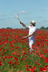 man playing in the poppy field