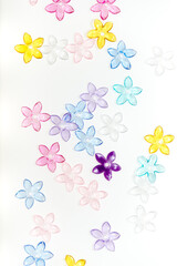 plastic (jewelry) five-petal flower beads on a white background