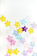 plastic (jewelry) five-petal flower beads on a white background