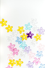 plastic (jewelry) five-petal flower beads on a white background