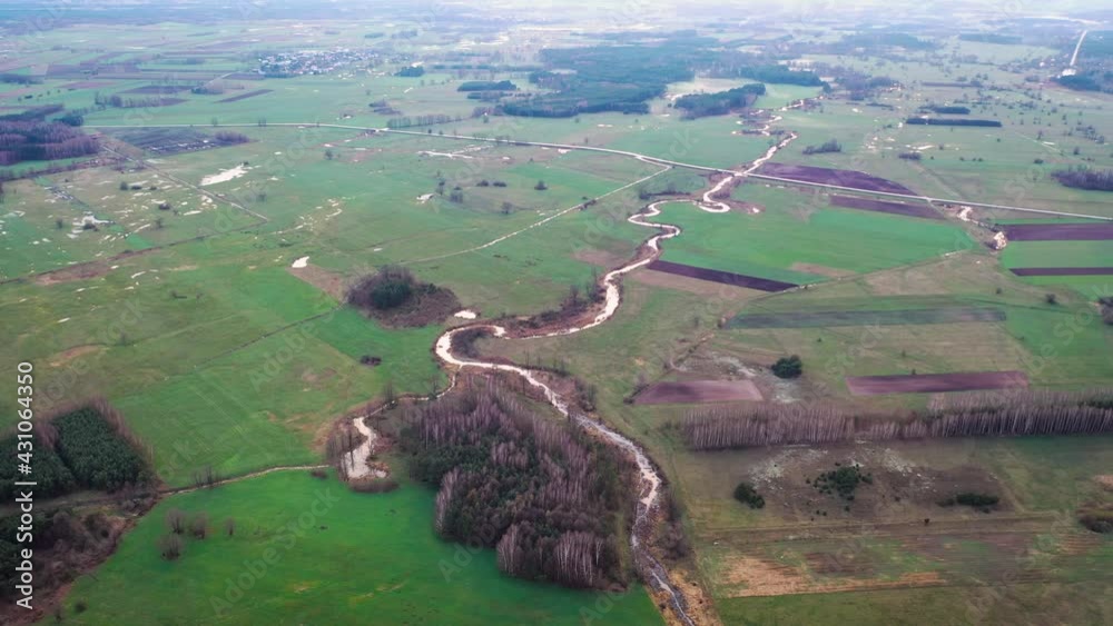 Wall mural Belczac river, branch of the Liwiec river near Paplin village in Masovian Voivodeship of Poland, 4k drone aerial video