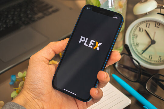 Kharkov, Ukraine - April 27, 2021: Plex online video app logo on the screen Apple iPhone, close-up