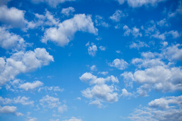Naklejka na ściany i meble Blue sky and white cotton clouds background. Alicante, Spain.