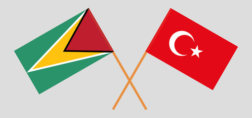 Crossed flags of Guyana and Turkey. Official colors. Correct proportion