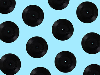 Vinyl records multiplied on soft blue background. Minimal abstract retro and vintage music concept. Retro technology idea.