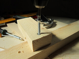   Close-up view of bending holes in wood instead of screws   
